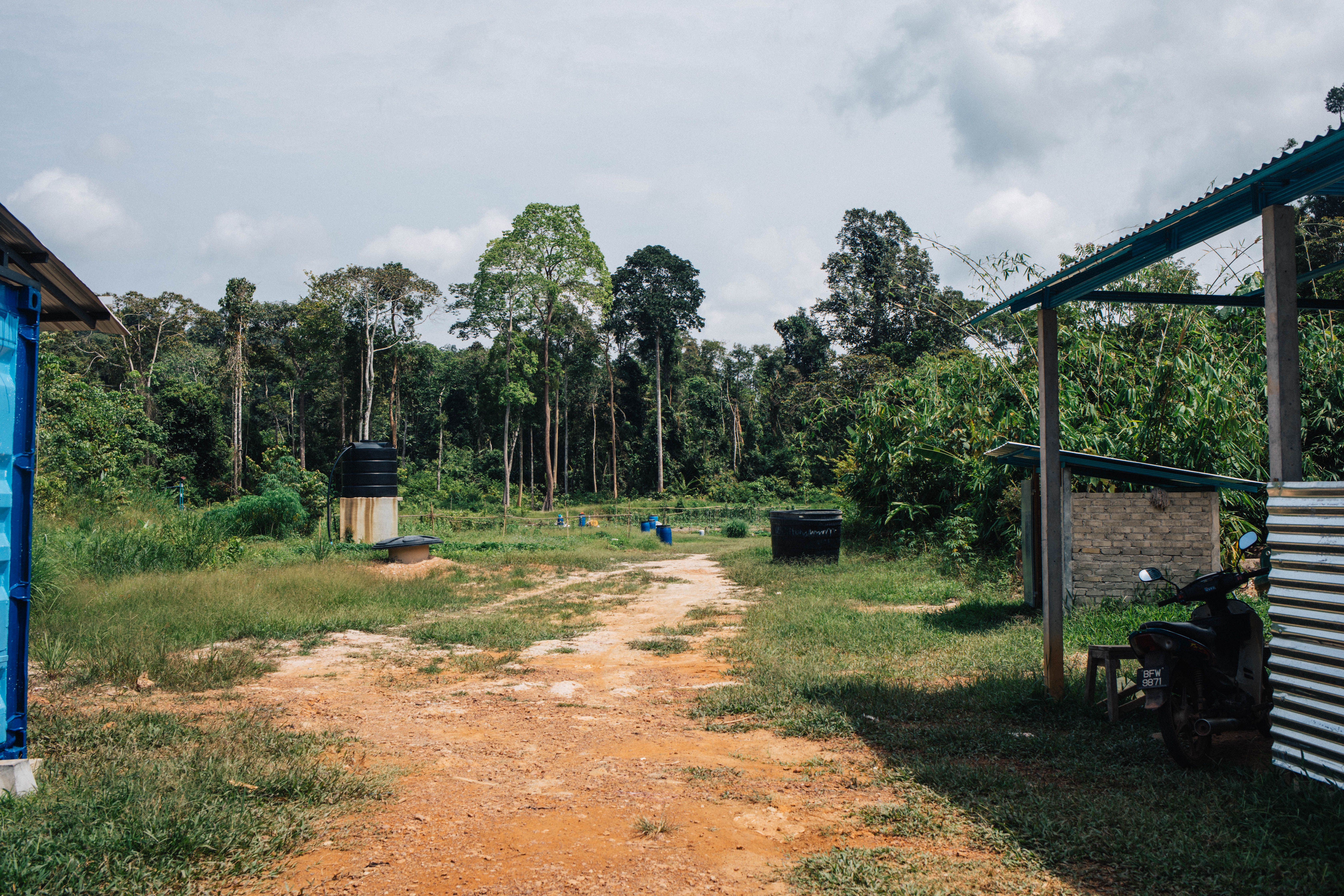 The structure on the left serves as a small library and computer centre for local kids, while the hut on the right houses a new small communal kitchen.